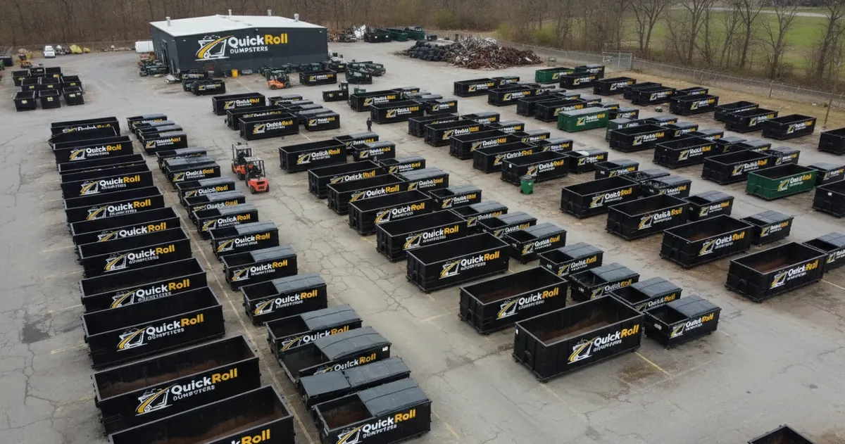 Quick Roll Dumpsters roll-off containers lined up in the Fayetteville yard